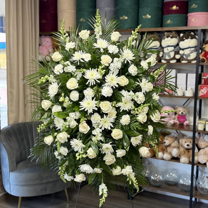 Serene White Standing Funeral Spray with Roses