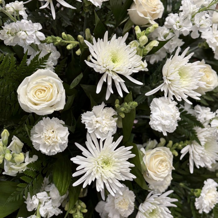 Serene White Standing Funeral Spray with Roses