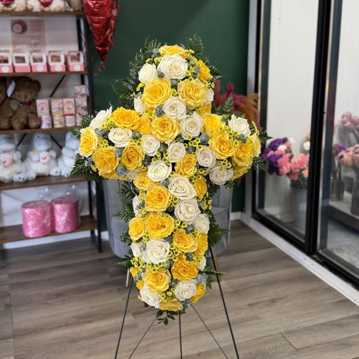 Radiant Cross — Yellow Rose Funeral Easel Arrangement